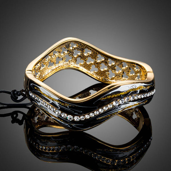 KHAISTA artistic black wave bangle on white background