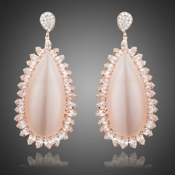 KHAISTA large opal waterdrop earrings on white background