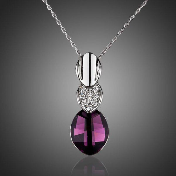 KHAISTA large purple crystal pendant necklace on white background