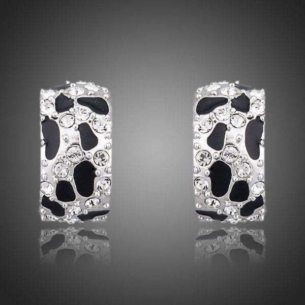 KHAISTA black leopard design clip earrings on white background