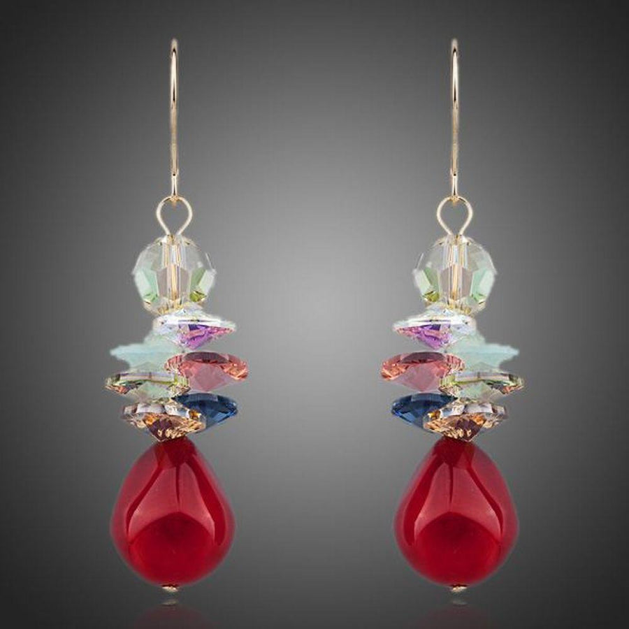 KHAISTA deep red crystal cluster drop earrings on white background