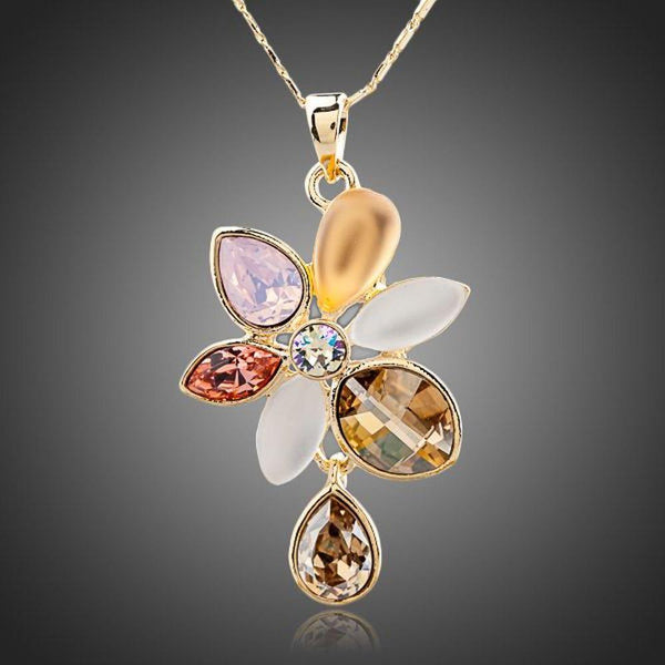 KHAISTA blooming flower crystal necklace on white background