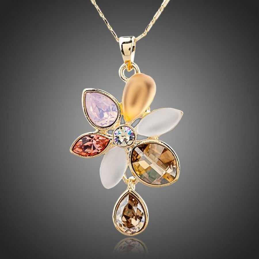 KHAISTA blooming flower crystal necklace on white background