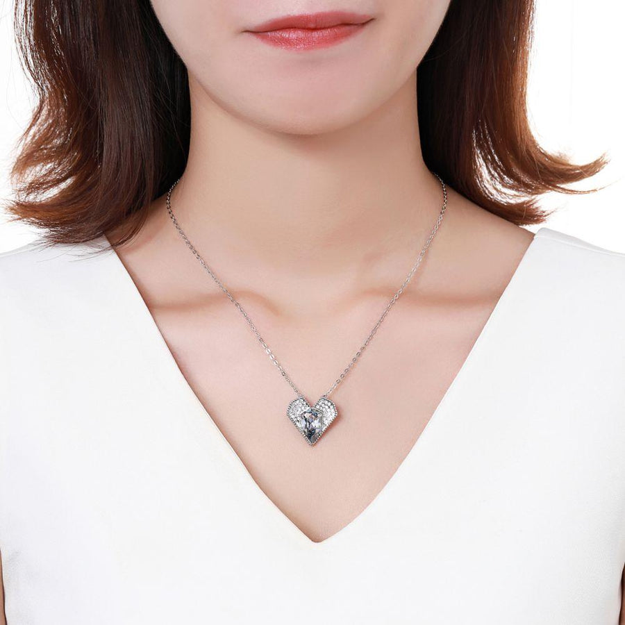 KHAISTA blue Austrian crystal vintage heart necklace on white background