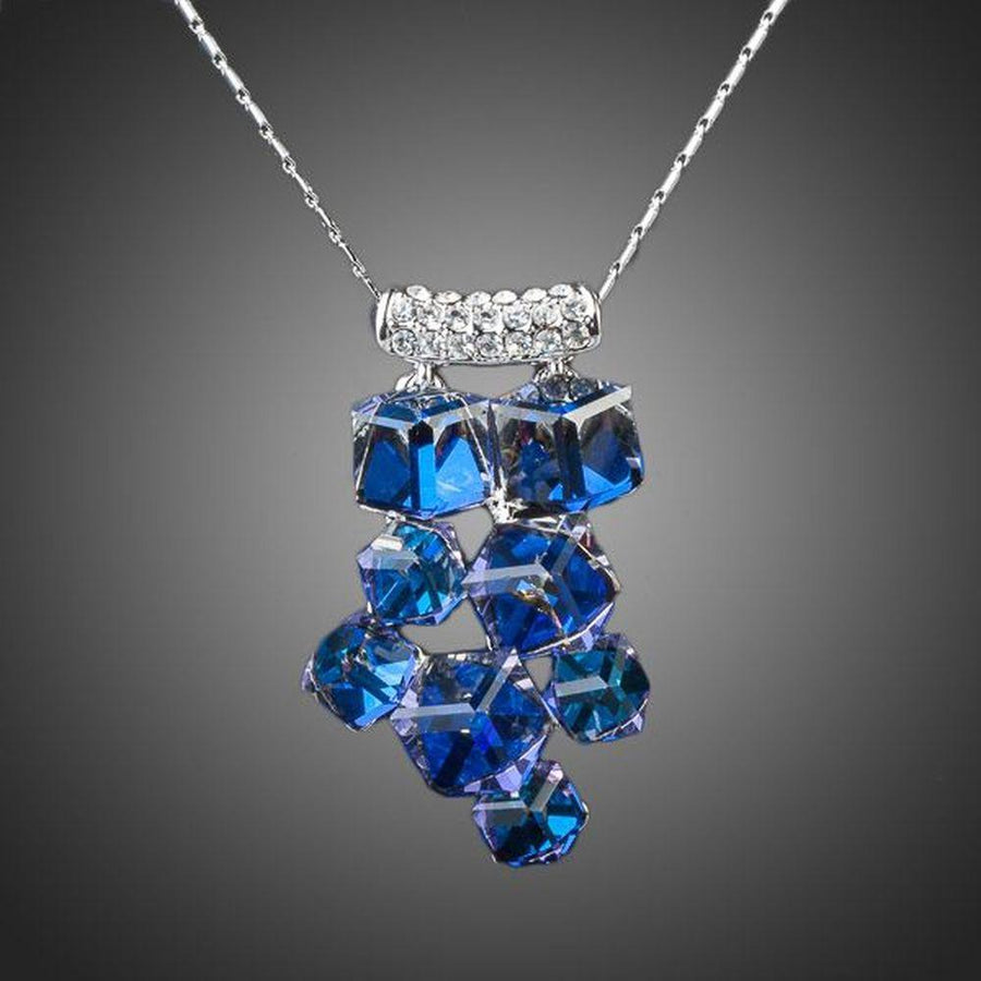 KHAISTA blue effect crystal cluster necklace on white background