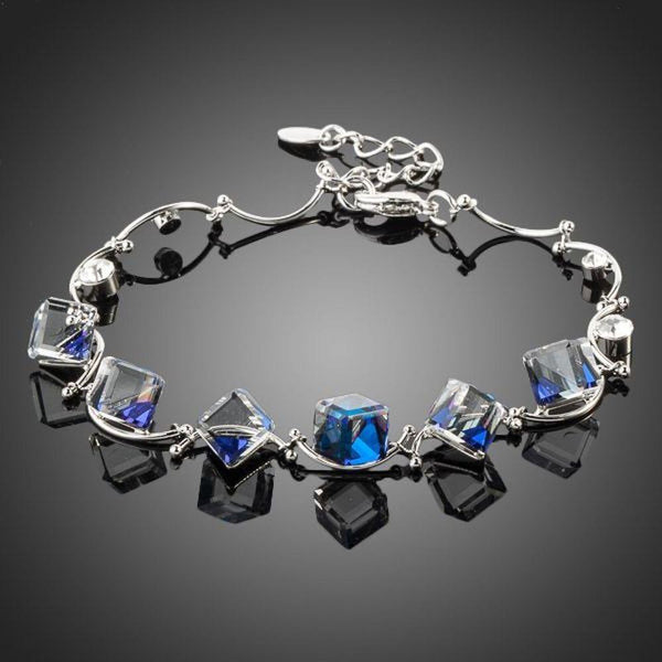KHAISTA blue square crystal charm bracelet on white background