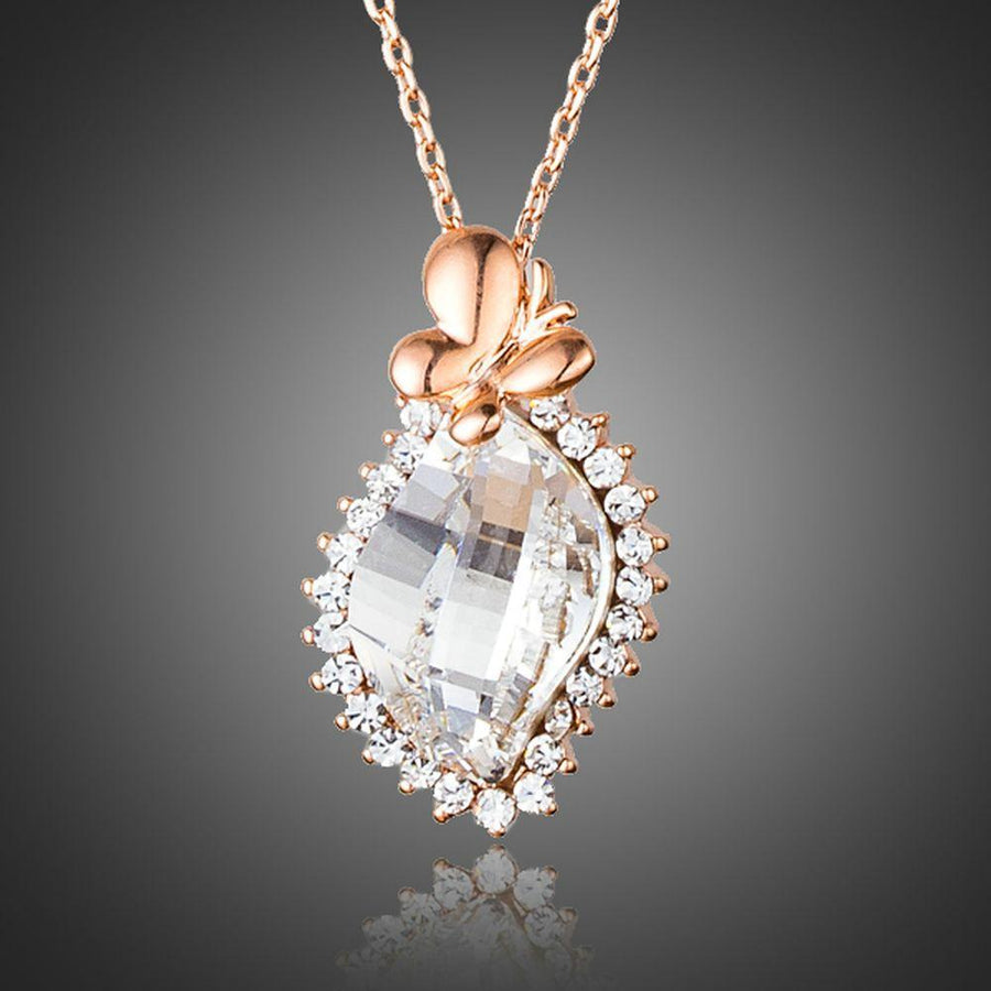 KHAISTA butterfly on crystal pendant necklace on white background