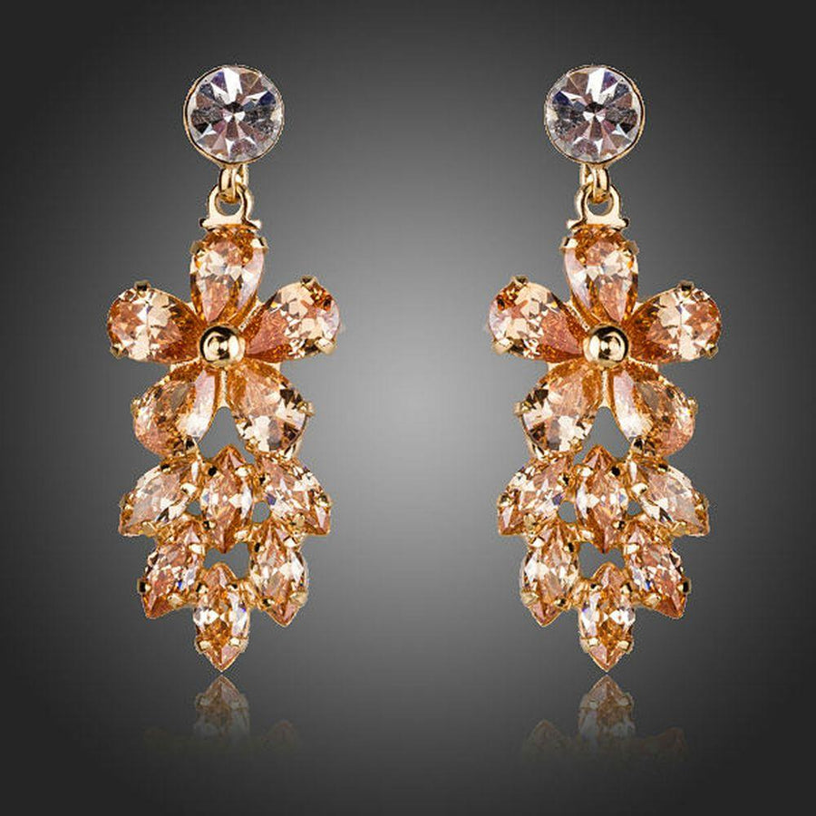 KHAISTA champagne crystal cluster drop earrings on white background