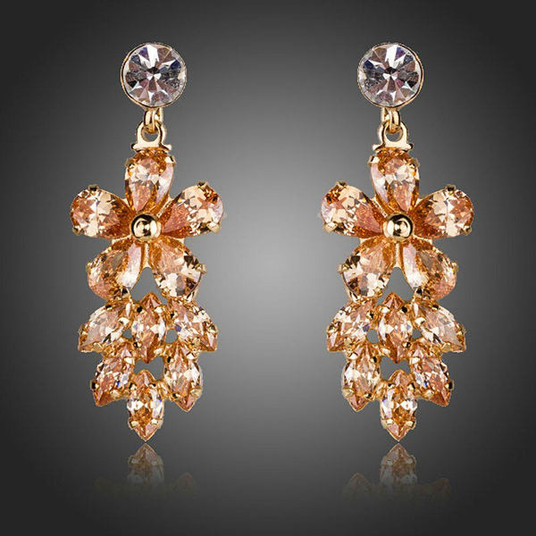 KHAISTA champagne crystal cluster drop earrings on white background