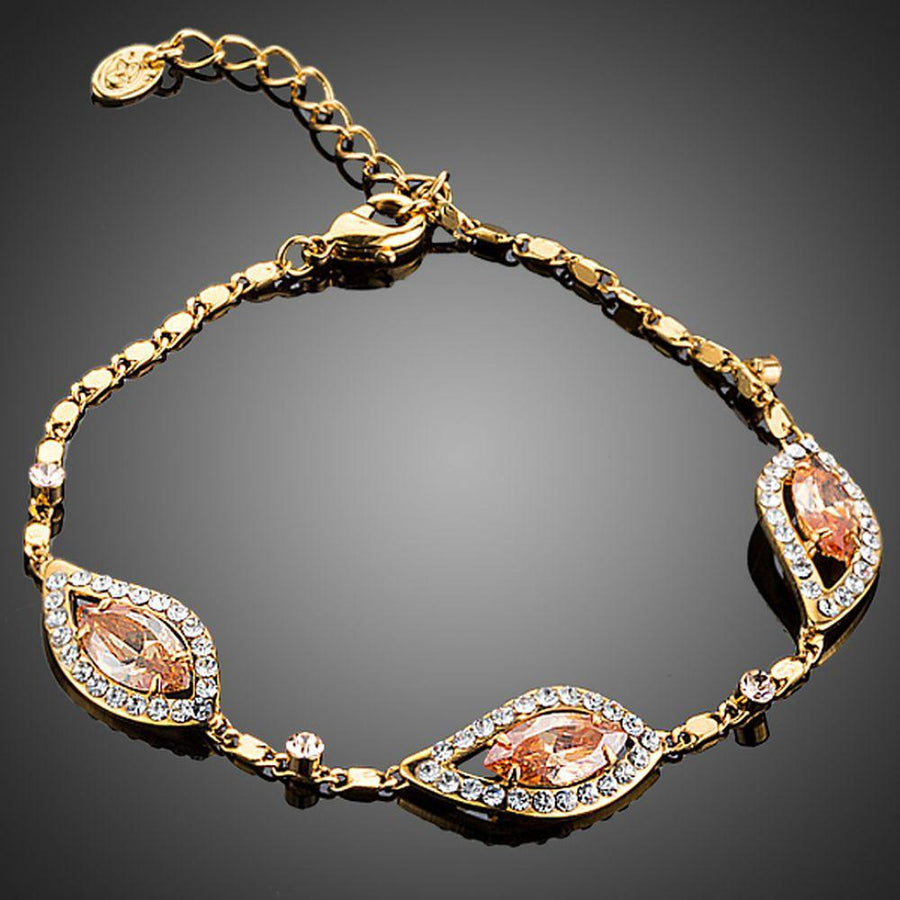 KHAISTA champagne cubic zirconia bracelet on white background