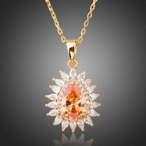 KHAISTA champagne CZ sunflower pendant necklace on white background