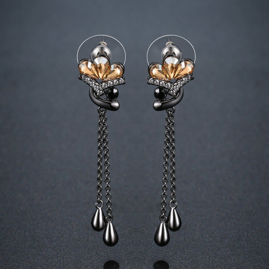 KHAISTA champagne crystal flower drop earrings on white background