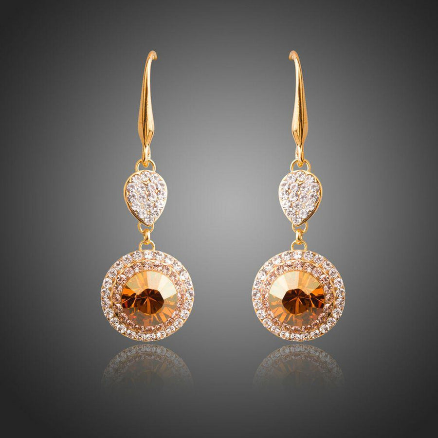 KHAISTA champagne round crystal drop earrings on white background