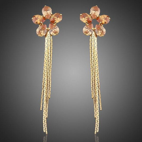 KHAISTA champagne sunflower crystal drop earrings on white background