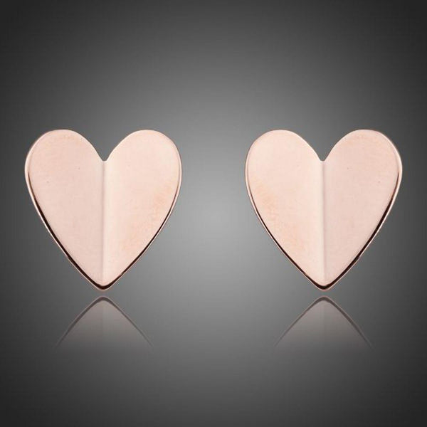 KHAISTA classic gold heart stud earrings on white background