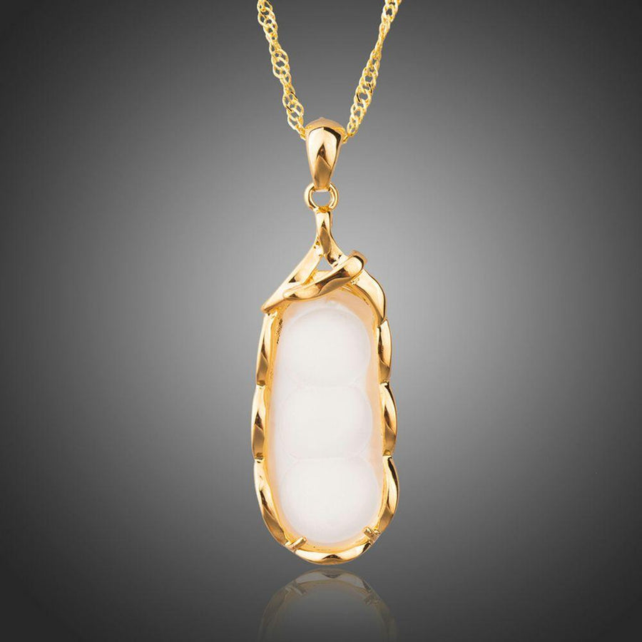 KHAISTA classic gold chain necklace on white background