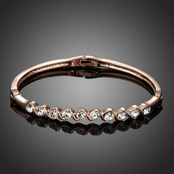 KHAISTA classic rose gold crystal bangle on white background