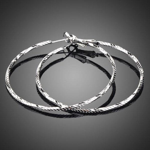 KHAISTA classic round crystal hoop earrings on white background