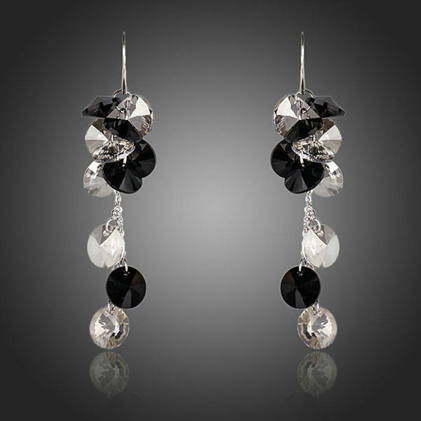 KHAISTA cluster crystal drop earrings on white background