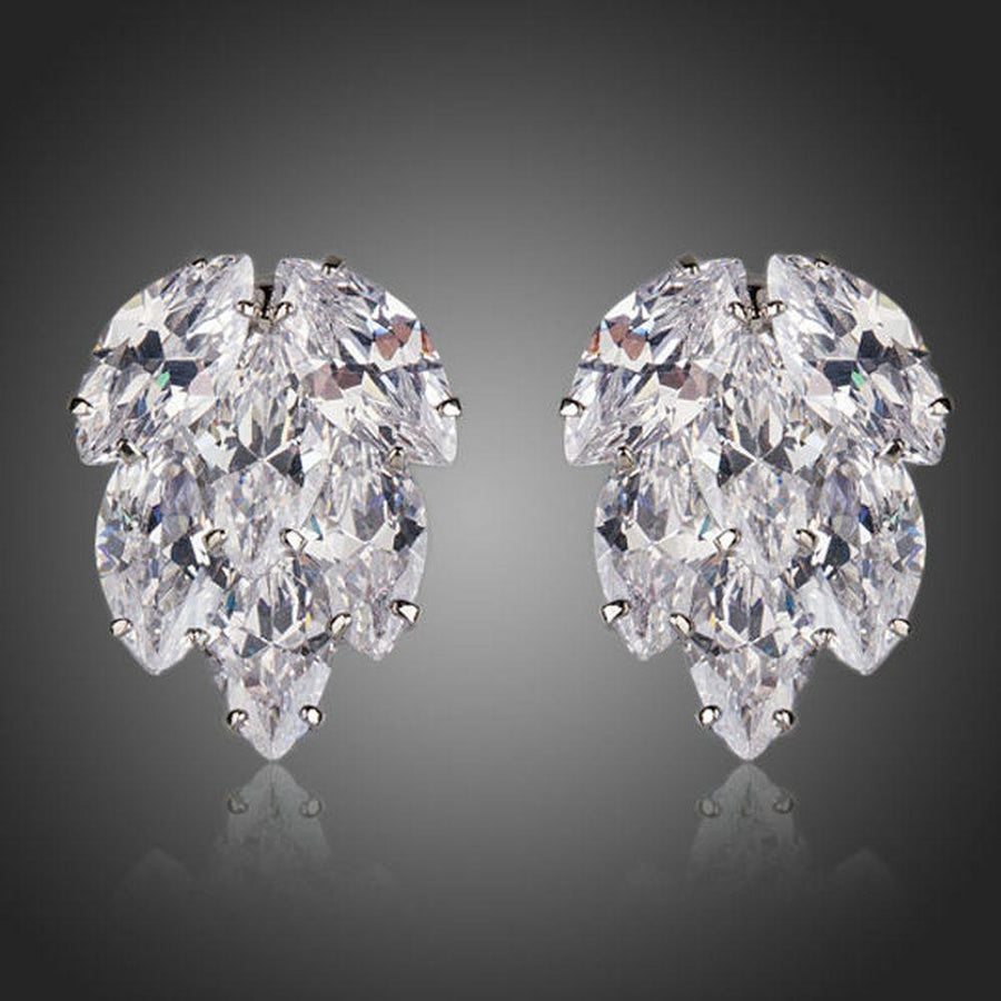 KHAISTA coupled CZ cluster stud earrings on white background