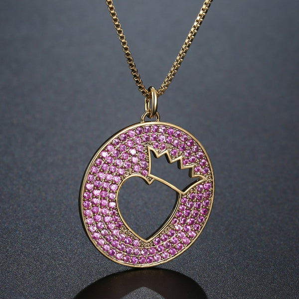 KHAISTA crown heart hollow round pendant necklace on white background