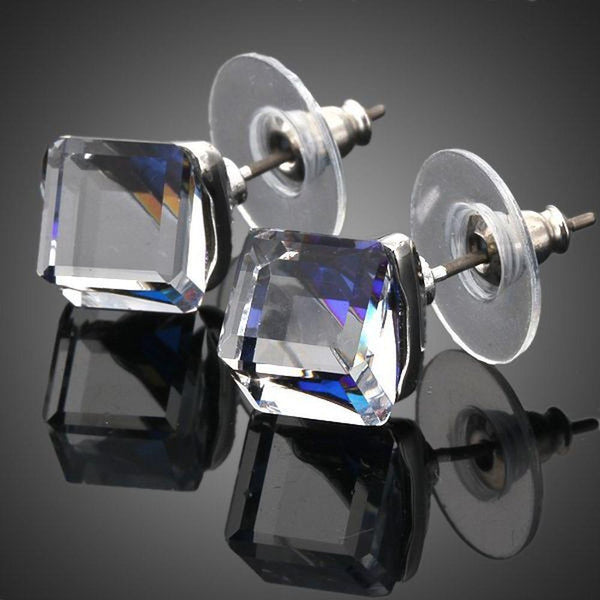 KHAISTA crystal blue square stud earrings on white background