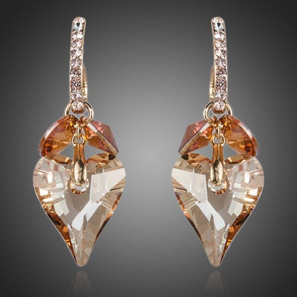 KHAISTA caramel crystal heart drop earrings on white background