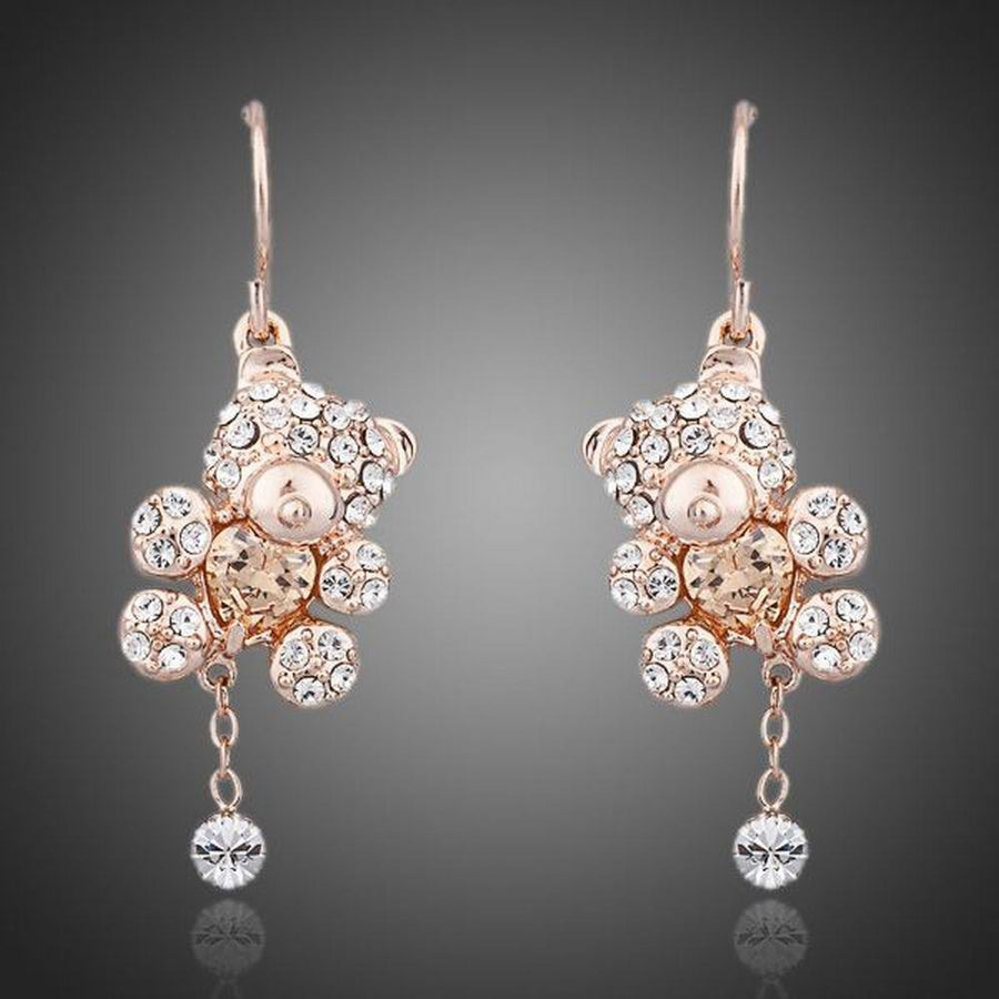 KHAISTA crystal teddy bear earrings on white background