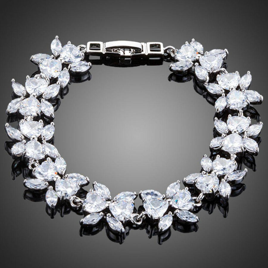 KHAISTA CZ flower garland bracelet on white background