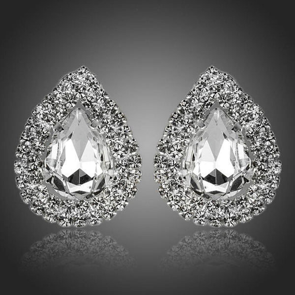 KHAISTA cubic zirconia stud earrings on white background
