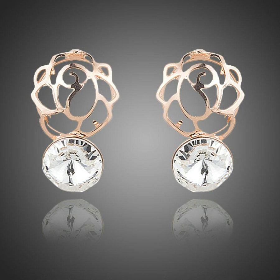 KHAISTA daily wear crystal stud earrings on white background