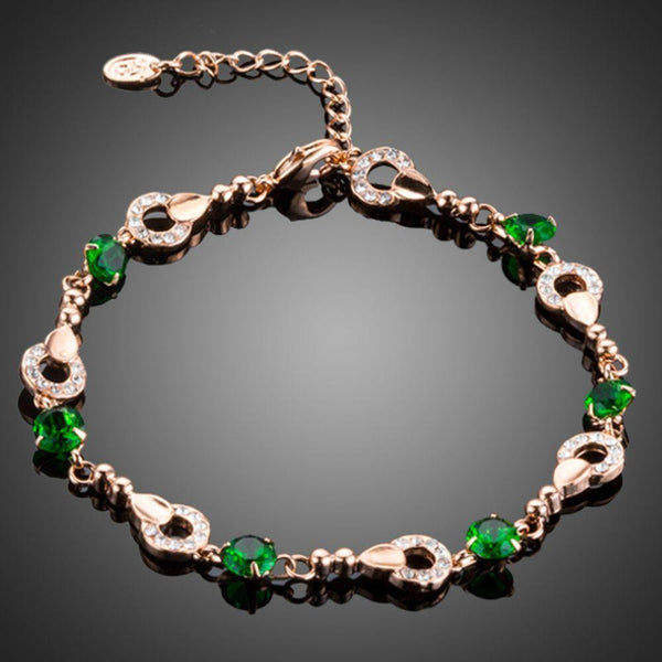KHAISTA dark green CZ link bracelet on white background