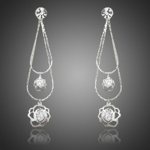 KHAISTA double flower crystal drop earrings on white background