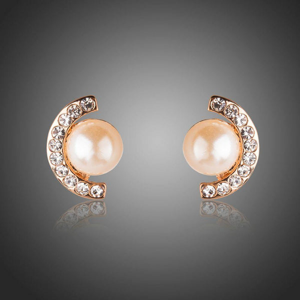 KHAISTA pearl half ellipse rhinestone stud earrings on white background
