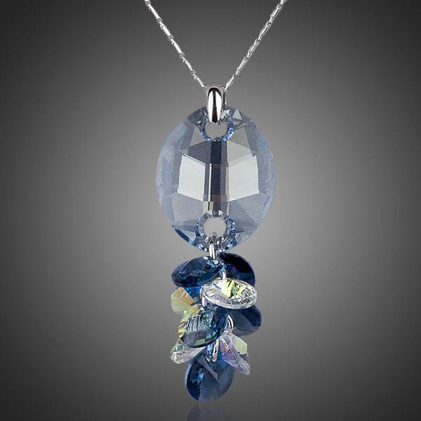 KHAISTA crystal fish design pendant necklace on white background