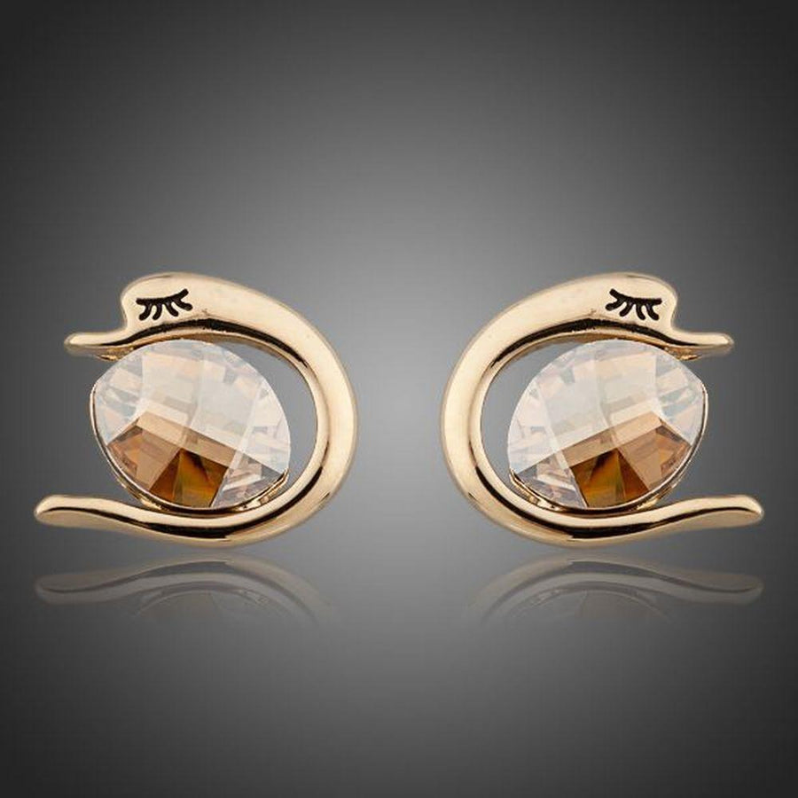 KHAISTA crystal fish porpoising stud earrings on white background