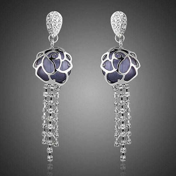 KHAISTA flower crystal tassel drop earrings on white background