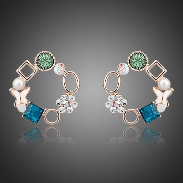 KHAISTA geometric circle crystal stud earrings on white background