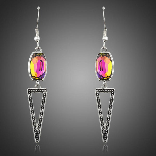 KHAISTA geometric design crystal drop earrings on white background