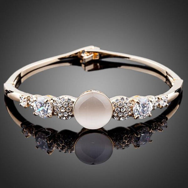 KHAISTA gold plated CZ bracelet bangle on white background