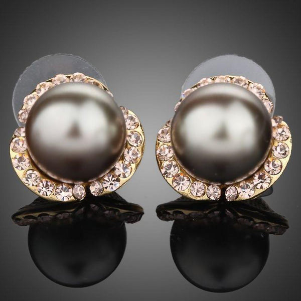 KHAISTA gold plated dome shaped stud earrings on white background