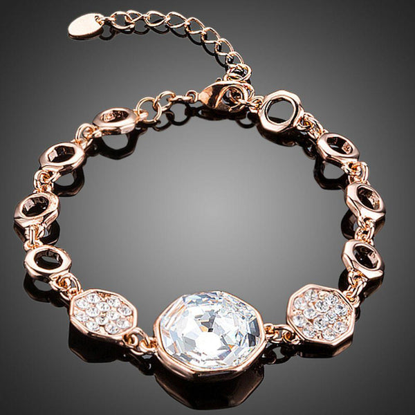KHAISTA gold plated geometric crystal bracelet on white background