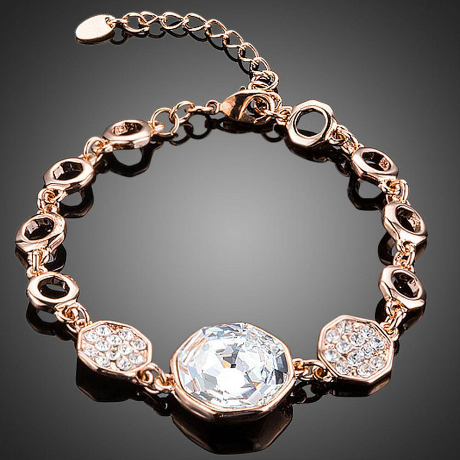 KHAISTA gold plated geometric crystal bracelet on white background
