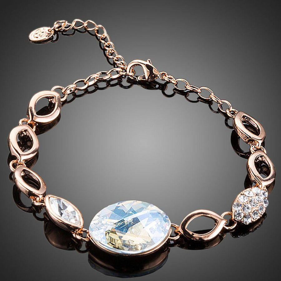 KHAISTA gold plated oval crystal bracelet on white background