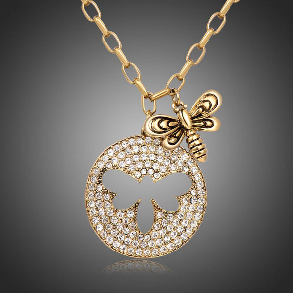 KHAISTA gold crystal bee pendant necklace on white background