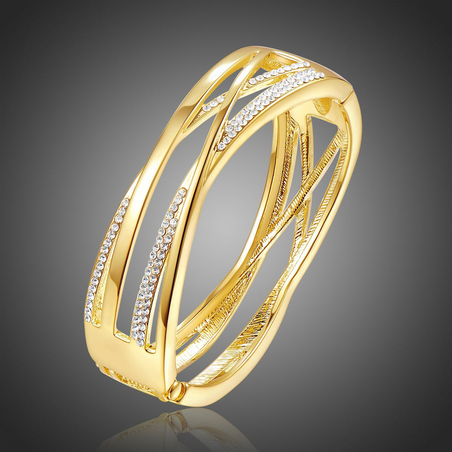 KHAISTA gold reflexions crystal bangle on white background
