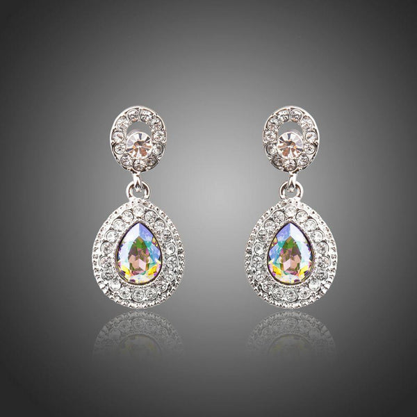KHAISTA gradual change crystal drop earrings on white background