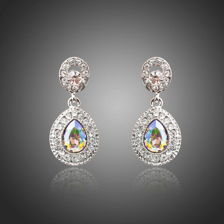 KHAISTA gradual change crystal drop earrings on white background