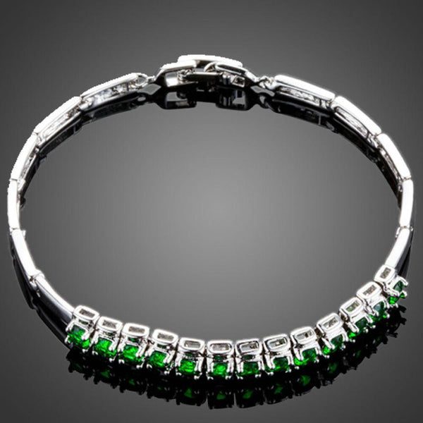 KHAISTA green CZ link chain bracelet on white background