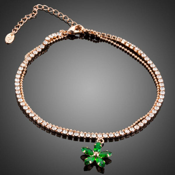 KHAISTA green flower charm bracelet on white background